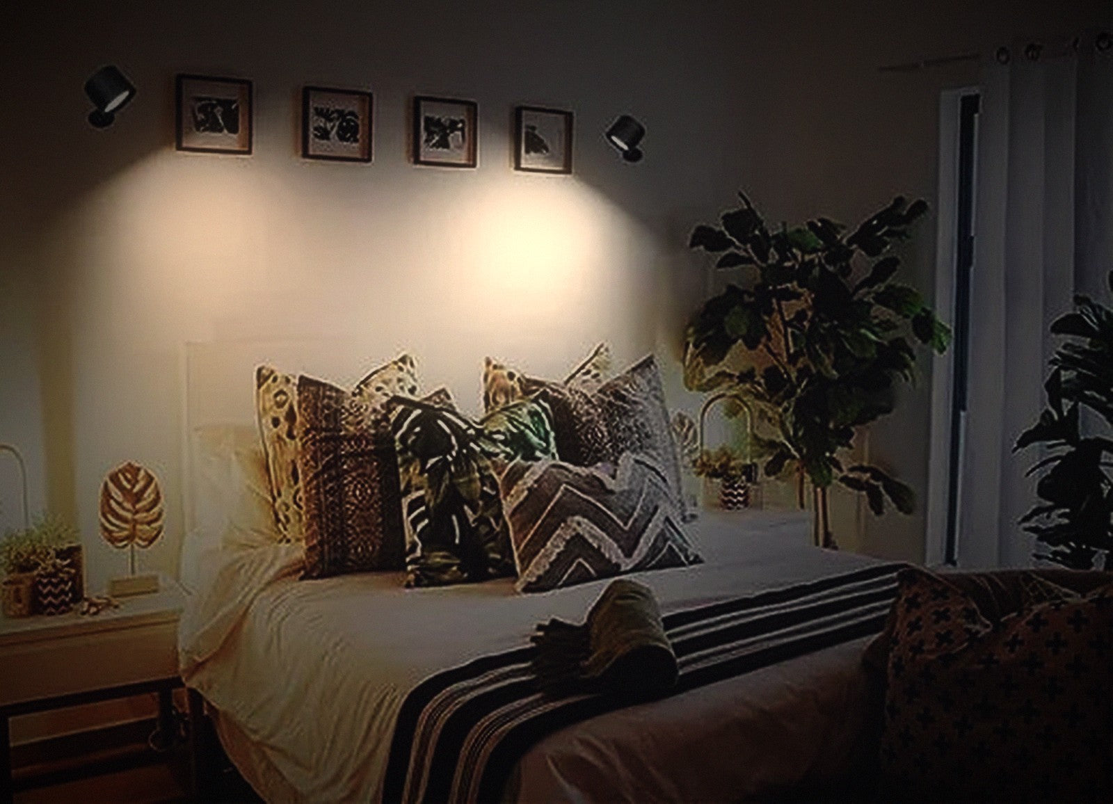 Bedroom lit by two warm Soft Hour wall lights