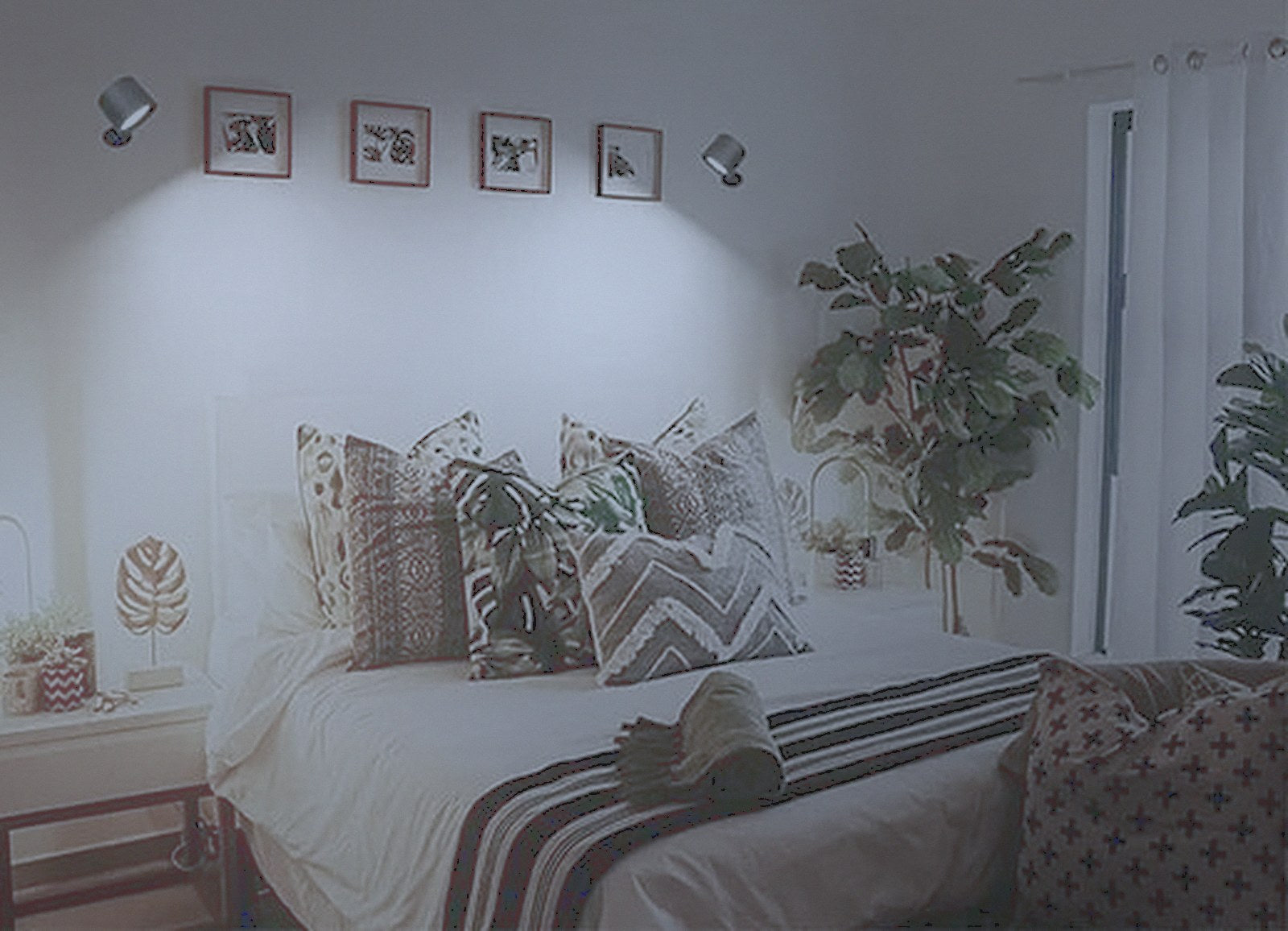 The same bedroom under flat, cold overhead light
